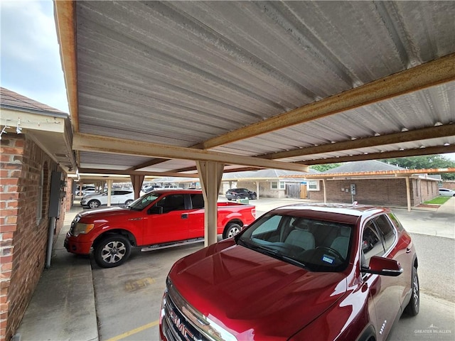 view of parking / parking lot with a carport