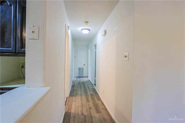 hallway featuring light hardwood / wood-style floors