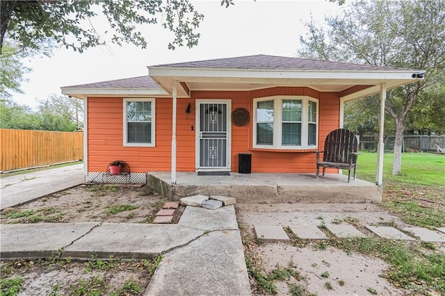 bungalow-style house featuring a front yard