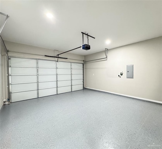 garage featuring a garage door opener and electric panel