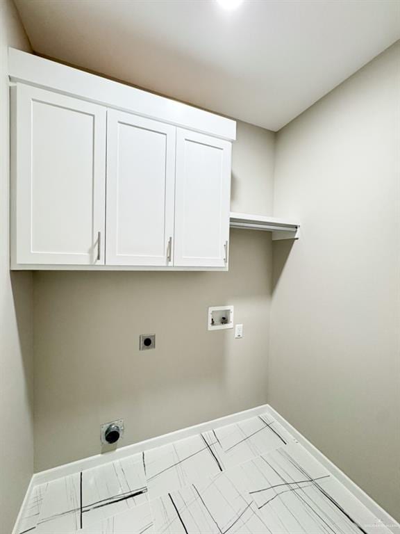 laundry area with hookup for a washing machine, electric dryer hookup, and cabinets