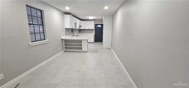 hallway featuring light hardwood / wood-style floors and sink