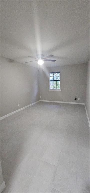 spare room featuring a textured ceiling and ceiling fan