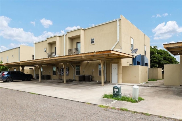 1304 E Camellia Ave Unit 2, Mcallen, TX 78501 - view of building exterior featuring central AC and covered parking