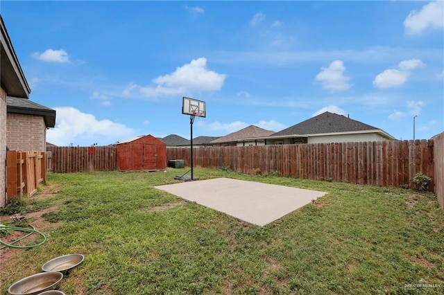 502 Oak Ridge St, Donna, TX 78537 - fenced backyard with a storage unit and a patio