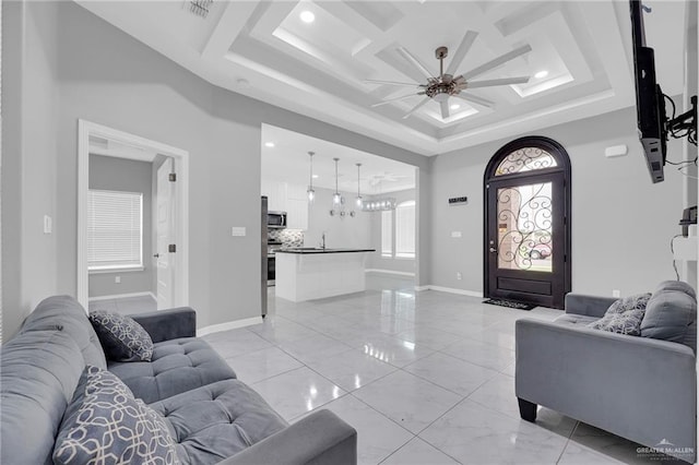 502 Oak Ridge St, Donna, TX 78537 - living area with a ceiling fan, light marble finish flooring, recessed lighting, and a tray ceiling