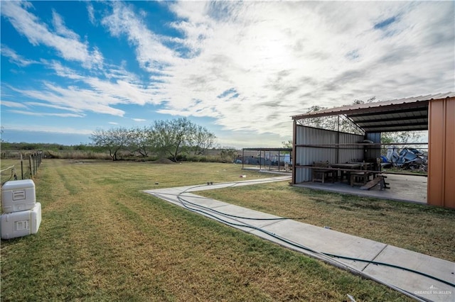 view of yard with a rural view