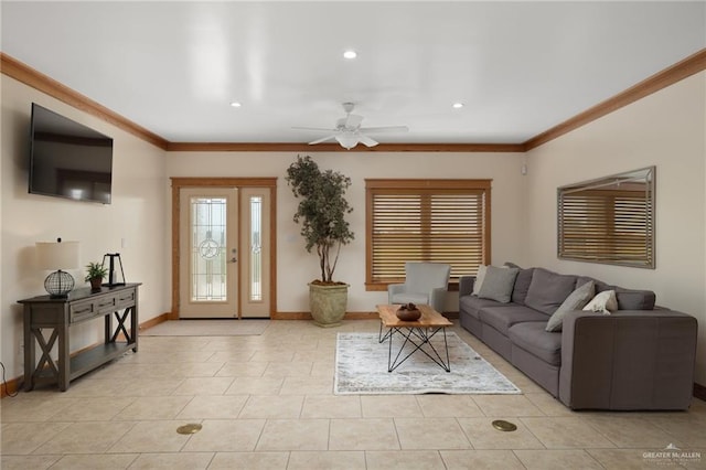 living room with ceiling fan, light tile patterned flooring, and ornamental molding