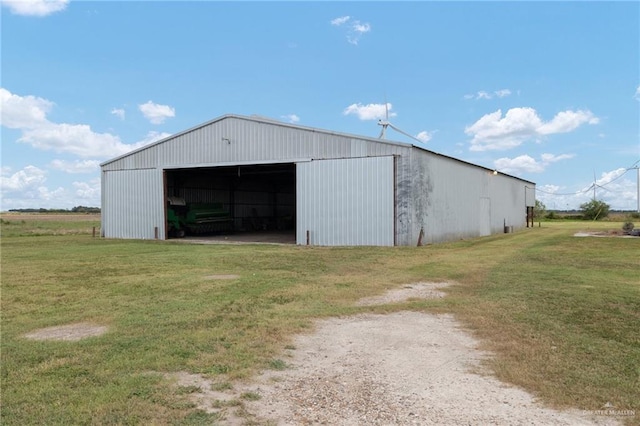 view of outdoor structure featuring a yard