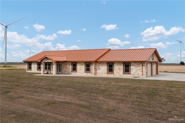 view of front of property featuring a garage and a front lawn