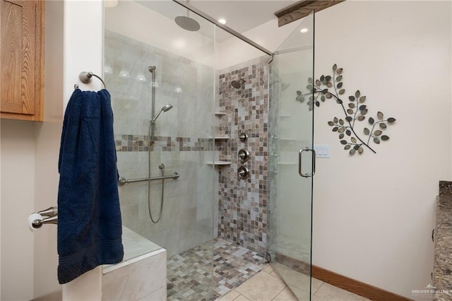 bathroom featuring tile patterned flooring and a shower with shower door