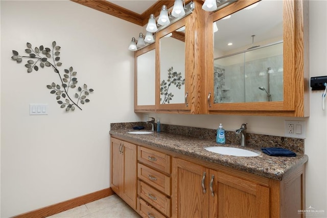 bathroom featuring vanity, tile patterned floors, an enclosed shower, and crown molding