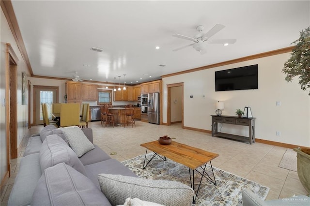 living room featuring ceiling fan, crown molding, and light tile patterned floors