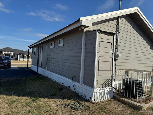 view of side of property with central AC