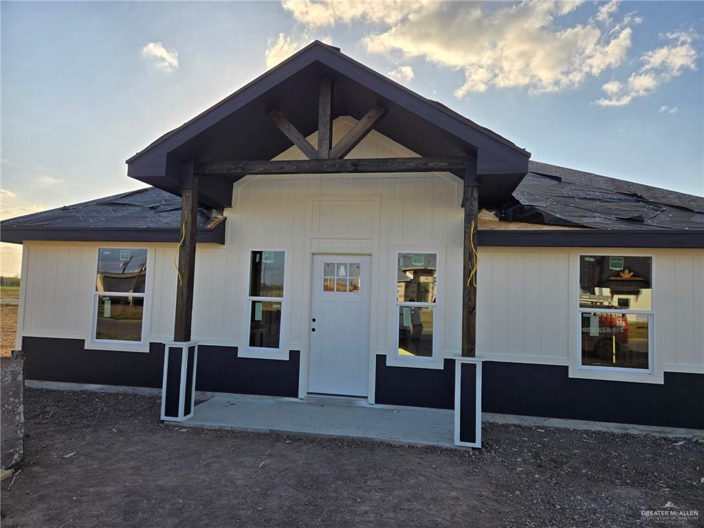 view of exterior entry at dusk