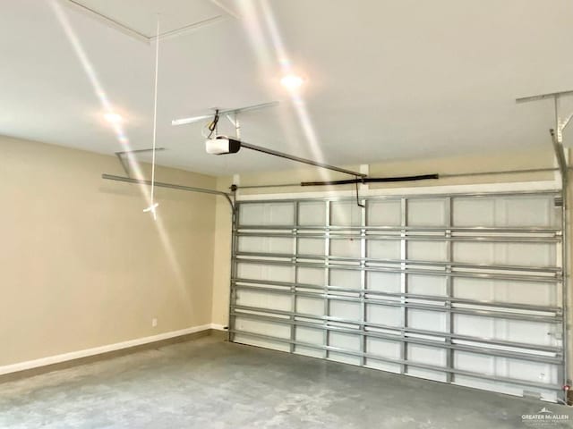 garage featuring baseboards and a garage door opener