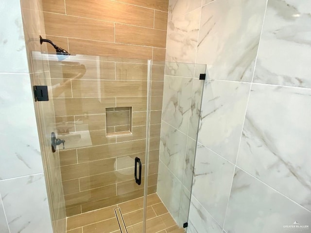 bathroom with a stall shower
