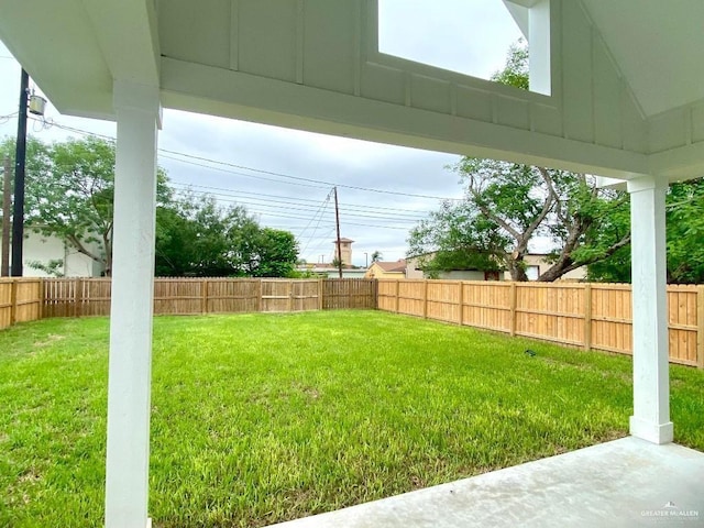 view of yard with a fenced backyard