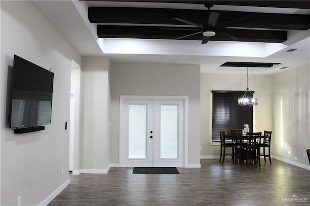 entrance foyer featuring a chandelier, french doors, dark hardwood / wood-style floors, and beamed ceiling