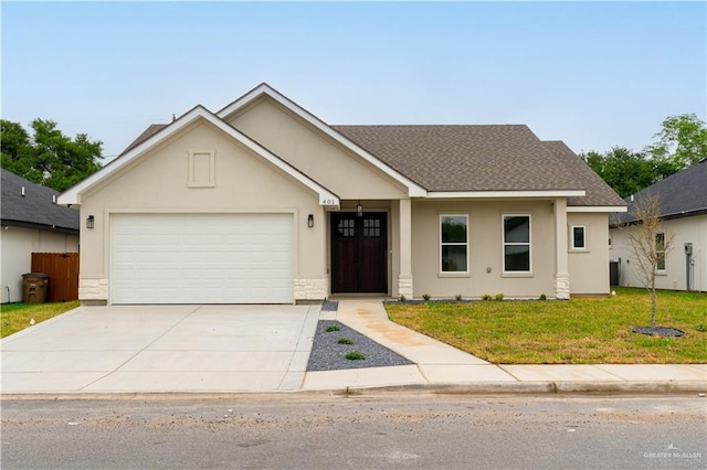 ranch-style home featuring an attached garage, a front lawn, stucco siding, and driveway