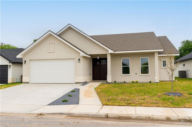 ranch-style home with a shingled roof, a front lawn, a garage, stucco siding, and driveway