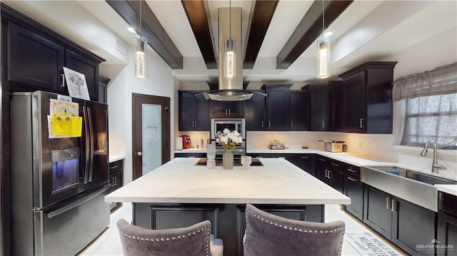 5403 Mauritius Ln, Edinburg, TX 78542 - kitchen with a sink, light countertops, fridge with ice dispenser, and beam ceiling