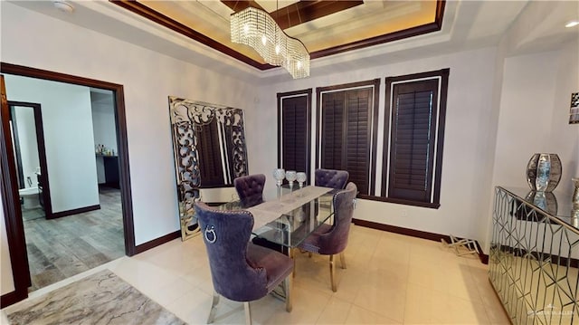 5403 Mauritius Ln, Edinburg, TX 78542 - dining room with baseboards, a raised ceiling, and a notable chandelier