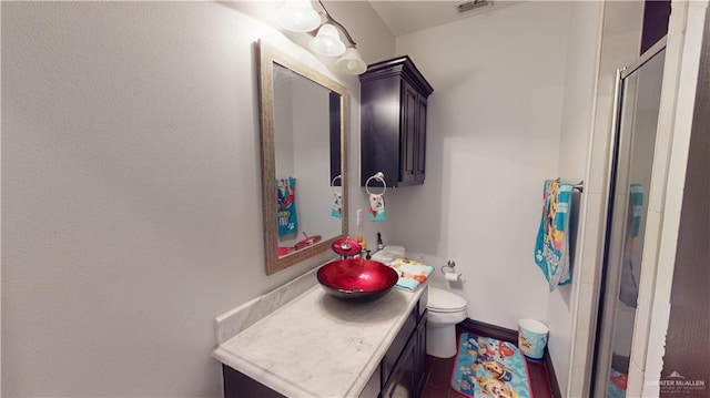 5403 Mauritius Ln, Edinburg, TX 78542 - full bathroom with a shower stall, toilet, vanity, and visible vents