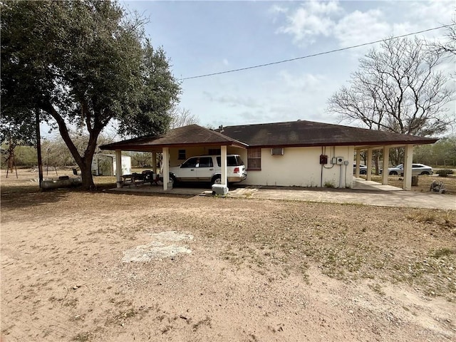 exterior space featuring driveway and a carport