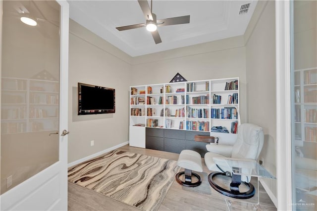 4001 Santa Erica St, Mission, TX 78572 - sitting room featuring ceiling fan, wood finished floors, baseboards, and a raised ceiling
