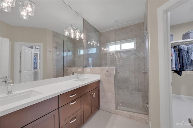 4001 Santa Erica St, Mission, TX 78572 - full bath with a walk in closet, double vanity, and a stall shower