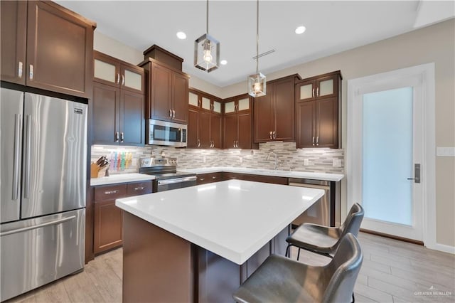 4001 Santa Erica St, Mission, TX 78572 - kitchen with stainless steel appliances, decorative backsplash, a sink, light countertops, and recessed lighting