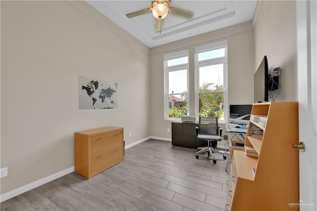 4001 Santa Erica St, Mission, TX 78572 - office with light wood-type flooring, a raised ceiling, a ceiling fan, and baseboards