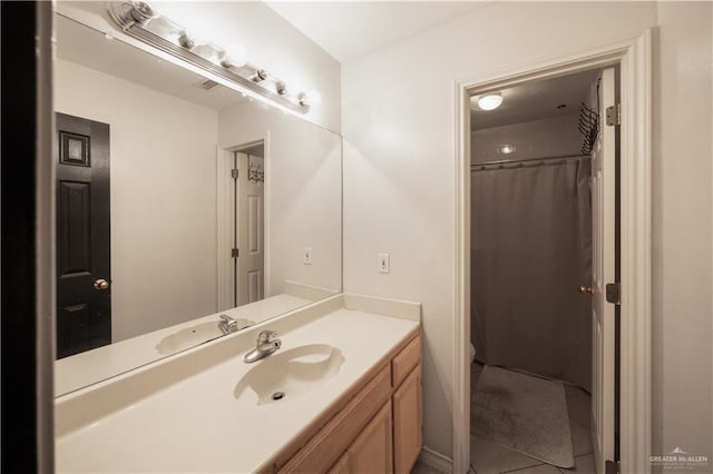 bathroom with vanity and tile patterned floors