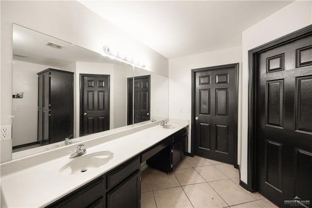 bathroom with tile patterned flooring and vanity