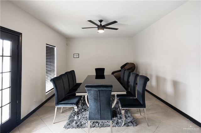 tiled dining room featuring ceiling fan