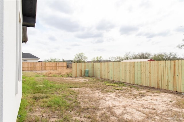 view of yard with a fenced backyard