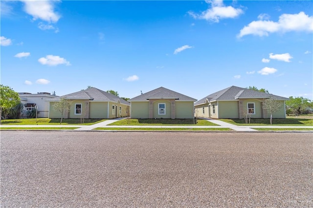 view of front of house featuring a residential view and a front yard