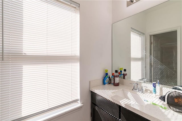 bathroom with vanity and a healthy amount of sunlight