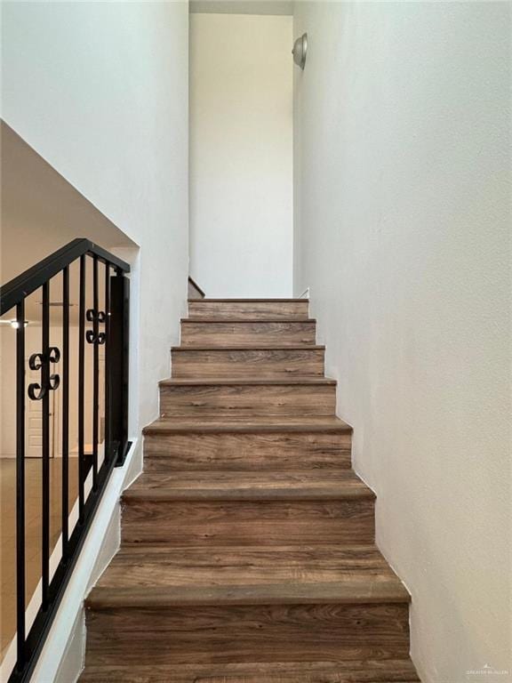 stairs with wood-type flooring