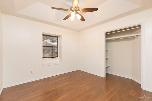 409 Kiwi Ave, Mcallen, TX 78504 - unfurnished bedroom featuring wood finished floors, baseboards, a closet, and a ceiling fan