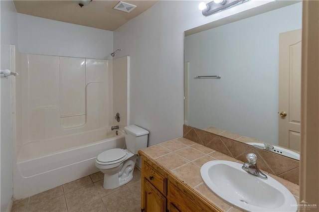 full bathroom featuring toilet, vanity,  shower combination, and tile patterned floors