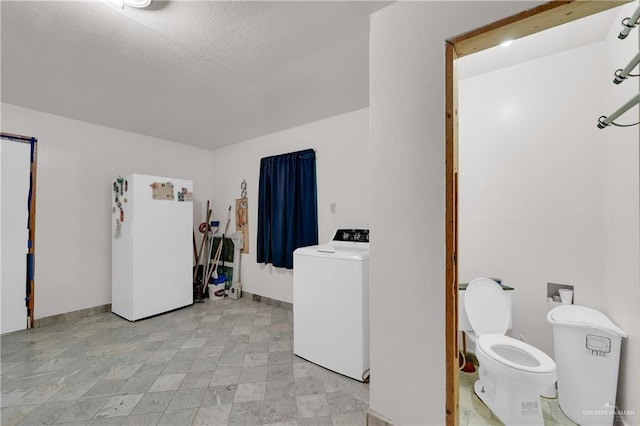 clothes washing area with washer / clothes dryer