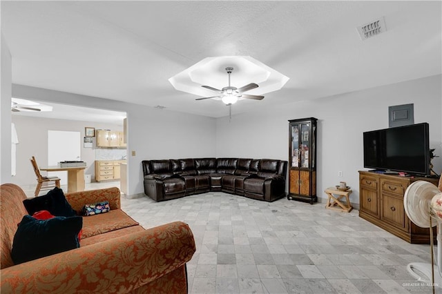 living room featuring ceiling fan