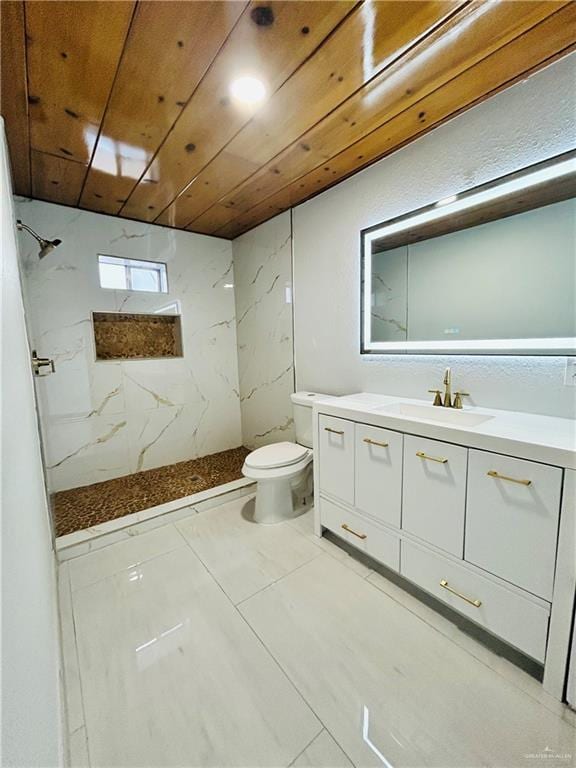 bathroom with tiled shower, vanity, toilet, and wooden ceiling