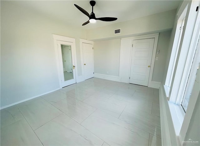 unfurnished bedroom featuring a closet and ceiling fan