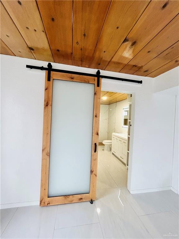 bathroom featuring tile patterned floors, toilet, vanity, and wooden ceiling