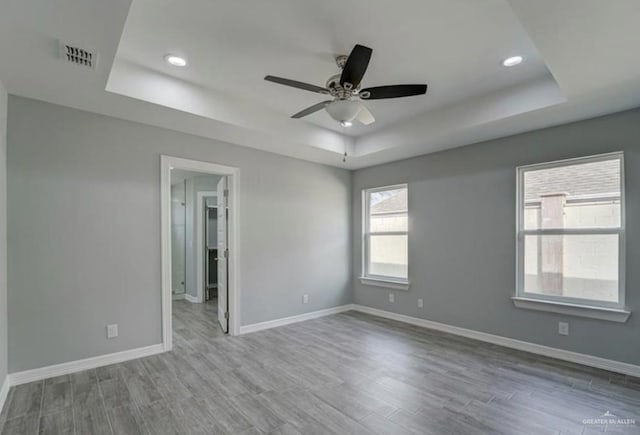 3708 Climax Dr, Edinburg, TX 78542 - spare room featuring a raised ceiling, wood finished floors, a ceiling fan, and recessed lighting