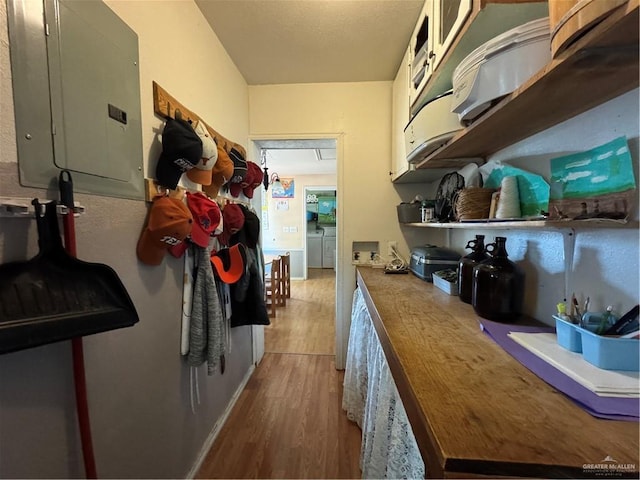 kitchen with light wood-type flooring and electric panel