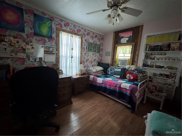 bedroom with hardwood / wood-style flooring and ceiling fan